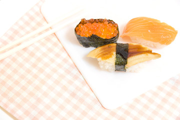 Different types of Sushi on a plate.