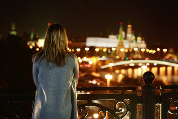 Fototapeta premium Night portrait of a girl in the autumn city