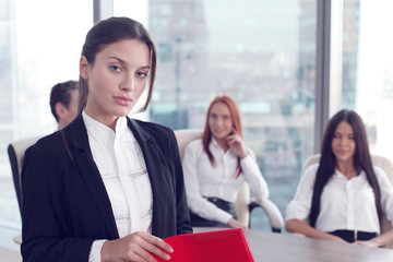 Portrait of business woman and team