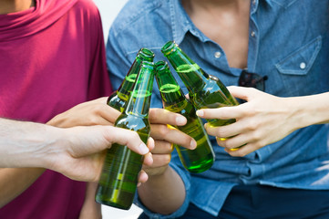 Friends toasting with beer
