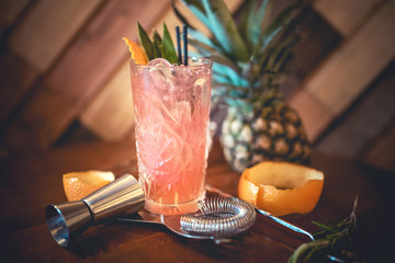 strawberry alcoholic cocktail with lime and orange, served as refreshment drink in local pub