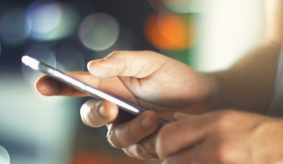 Business Man using Mobile Phone in Office