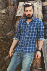 Handsome bearded man with axe