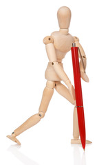 Small wooden dummy and ballpoint pen