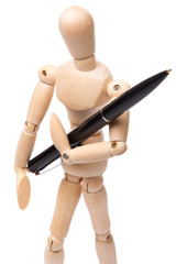 Small wooden dummy and ballpoint pen