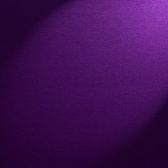 Purple felt background illuminated by a spotlight