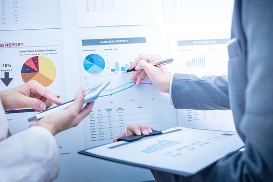 Business people discussing the charts and graphs showing the res