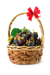 mangosteen thai fruit in basket isolated on white background.