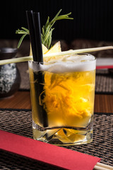 alcoholic cocktail in a sushi restaurant on a dark desk