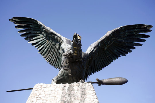 Statue of the famous hungarian legendary Turul bird against blue