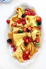 hot crepes with summer berry mix