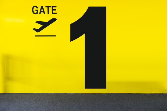 Airport Gate Sign With a Luggage and Number
