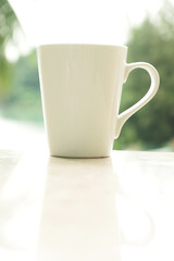 Coffee Cup with a Nature Scenery in the Morning