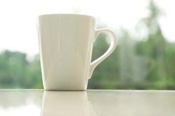 Coffee Cup with a Nature Scenery in the Morning