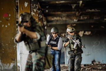 Fototapeta premium Photojournalist documenting war conflict