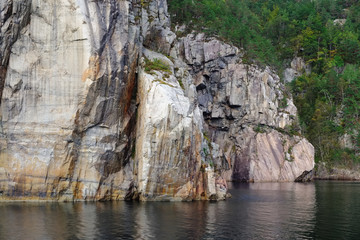 vertical rock formation in water