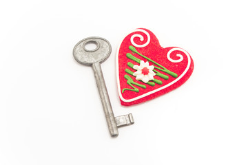 Key and heart isolated on white