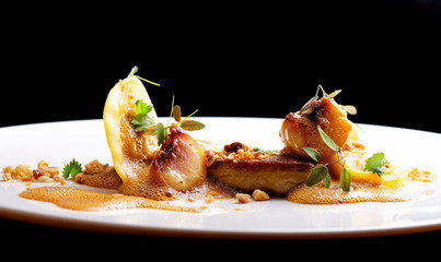 Haute cuisine, roasted Foie gras with homemade ravioli and apples © Visionsi