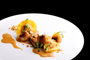 Haute cuisine, roasted Foie gras with homemade ravioli and apples
