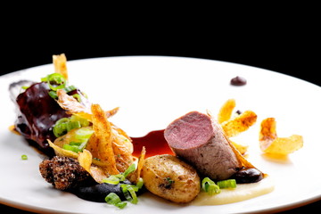 Haute cuisine, grilled Lamb steaks with a sauce of port, and potatoes