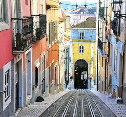View of the colorful street with rails in Lisbon