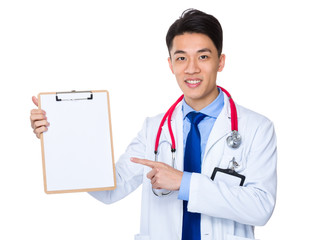 Doctor with finger point to clipboard