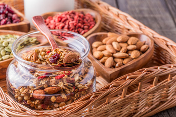 Homemade granola with milk, berries, seeds and nuts