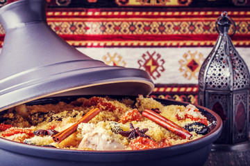 Traditional moroccan tajine of chicken with dried fruits and spi