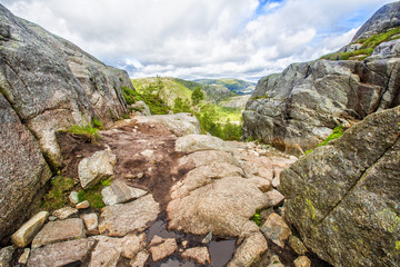 Fototapeta na wymiar Hiking trail and alpine landscape of the Preikestolen and Lysefjord area in Rogaland, Norway