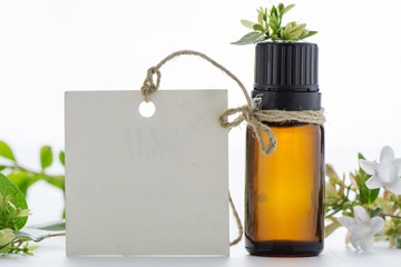 Essential oil, empty tags and  flowers