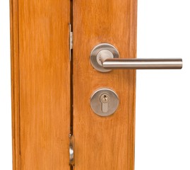 Obraz premium Lock and Door Handle on Golden Brown Wooden Door