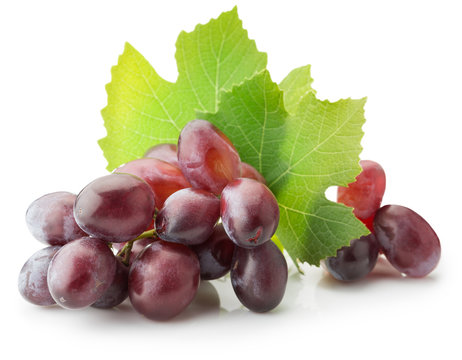Pink grapes with leaves isolated on the white background
