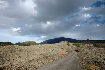 Fototapeta na wymiar Path and Old Cooled Lava In Etna National Park, Sicily