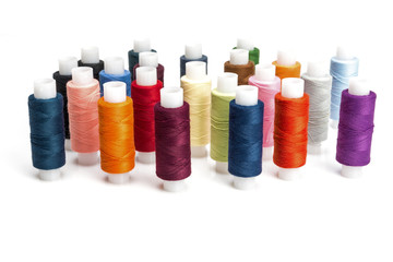 multicolored threads for sewing on spools