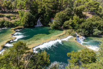 Scenic view of cascades and lush landscape from above at the Krka National Park in Croatia.