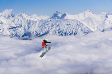 Flying snowboarder on mountains, extreme sport