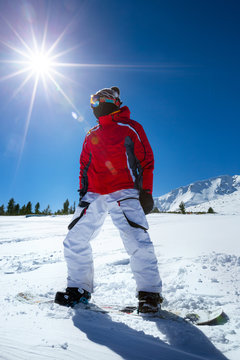 Snowboarder standing on board