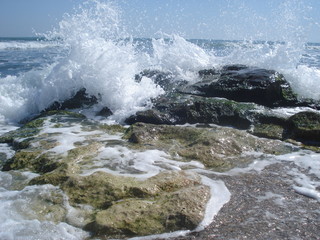 Sea waves crashing against rocks at the seashore