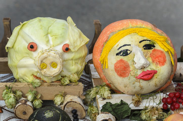 Pumpkin as a person and cabbage in the form of the head of the p