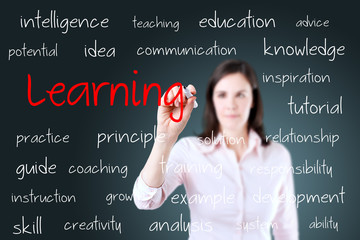 Young business woman writing learning concept 