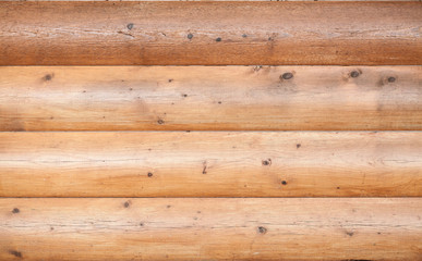 Naklejka premium Wooden wall made of logs. Natural background