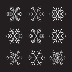 Collection of White Snowflakes and Black Background.