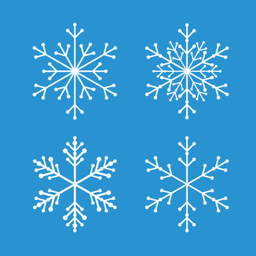 Collection of White Snowflakes and Blue Background.