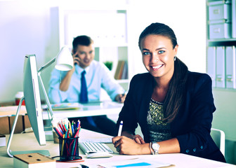 .Portrait of an attractive young businesswoman sitting in front