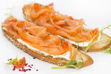 sandwiches with salmon caviar and greens adorned