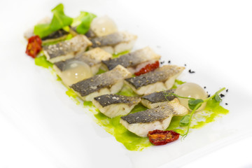 baked black cod fish on a white background in the restaurant