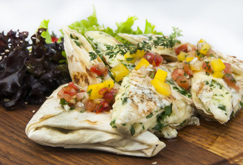 pita bread with vegetables on a plate in a restaurant