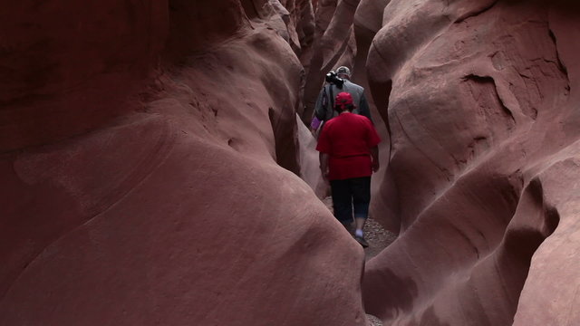 Narrow desert mountain slot canyon friends hiking and climbing HD 1600