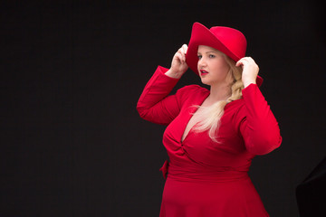 Sexy plus size woman in red hat with red lips.