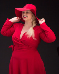 Sexy plus size woman in red hat with red lips.